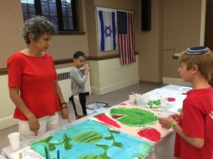 Member, Jennifer Moses coaches the artists.