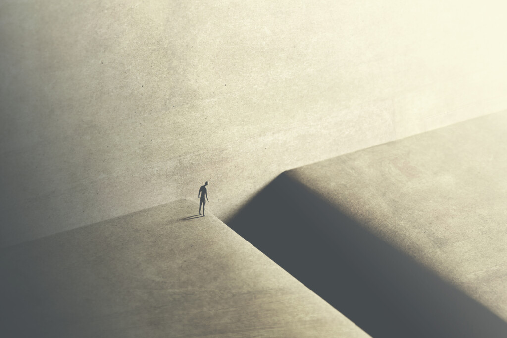 man thinking about taking big risk to reach the other side with a big jump